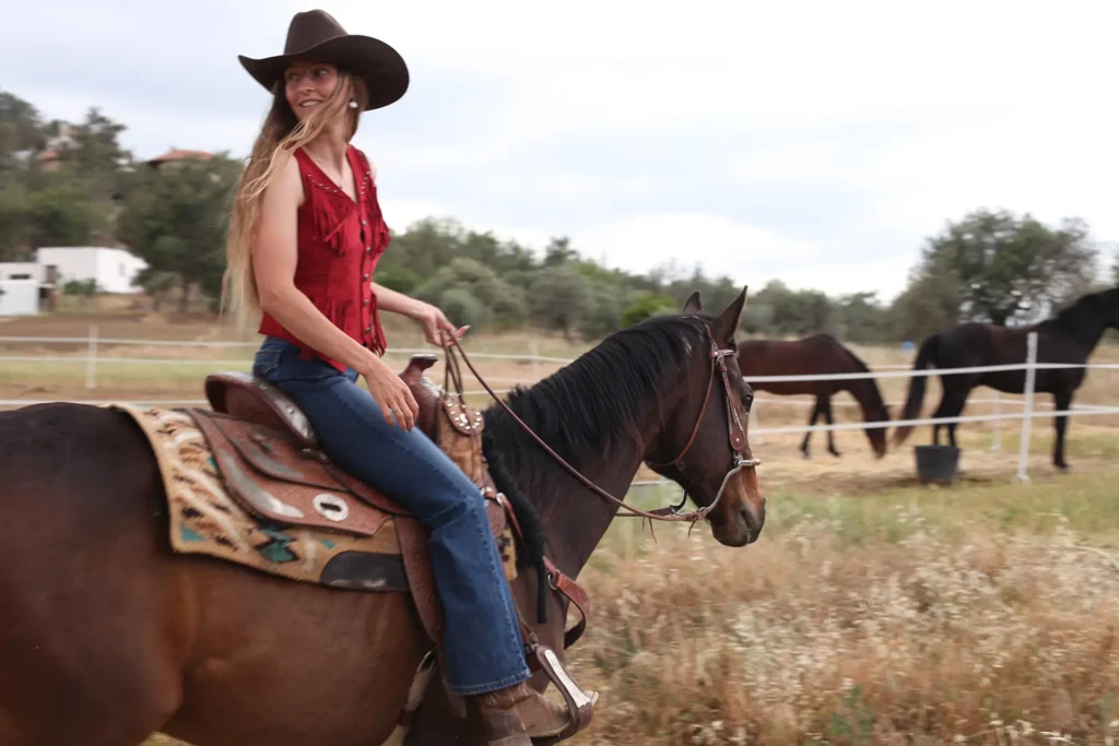woman riding a horse western trail riding in Cyprus