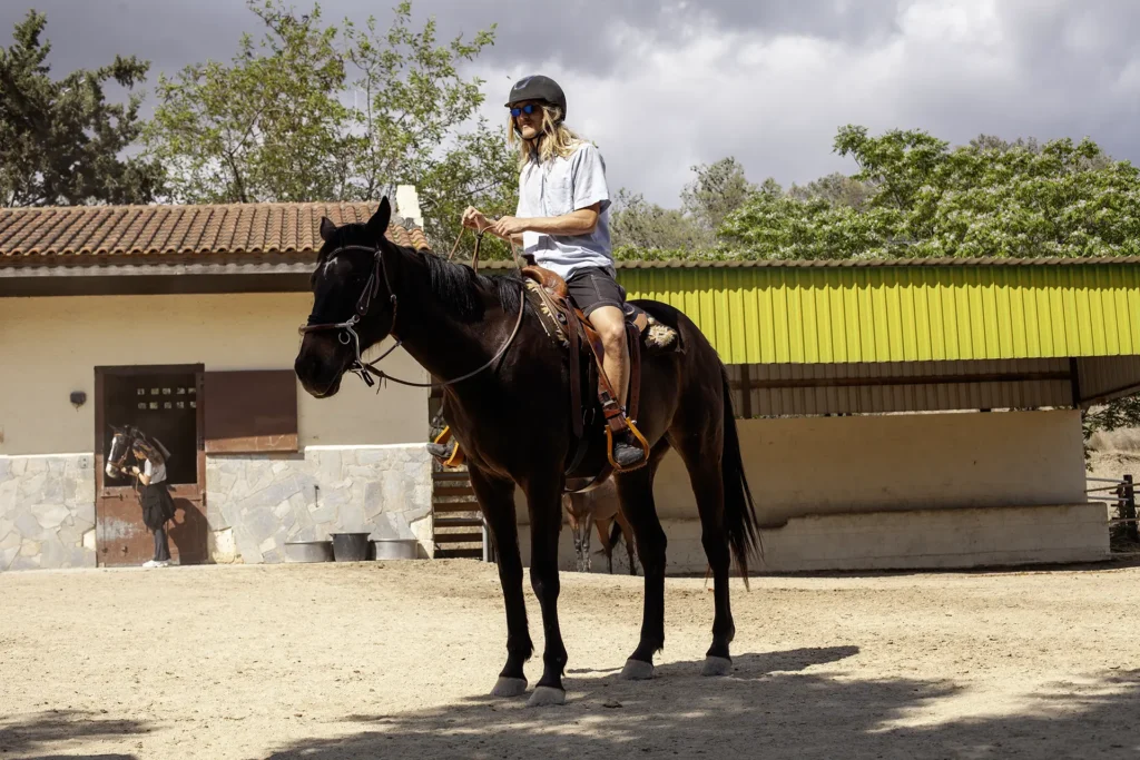 beginner rider in sand school western trail riding in Cyprus