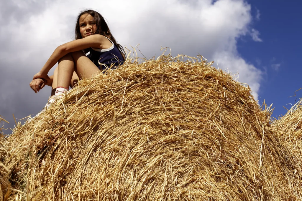 girl sat on hay bail western trail riding in Cyprus